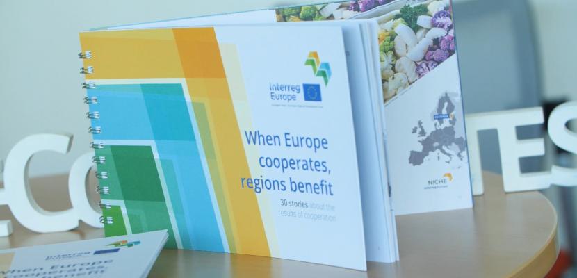 Our publication 'When Europe cooperates, regions benefit' Publication entitled 'When Europe cooperates, regions benefit' placed upon a table with hashtag Europe cooperates behind it